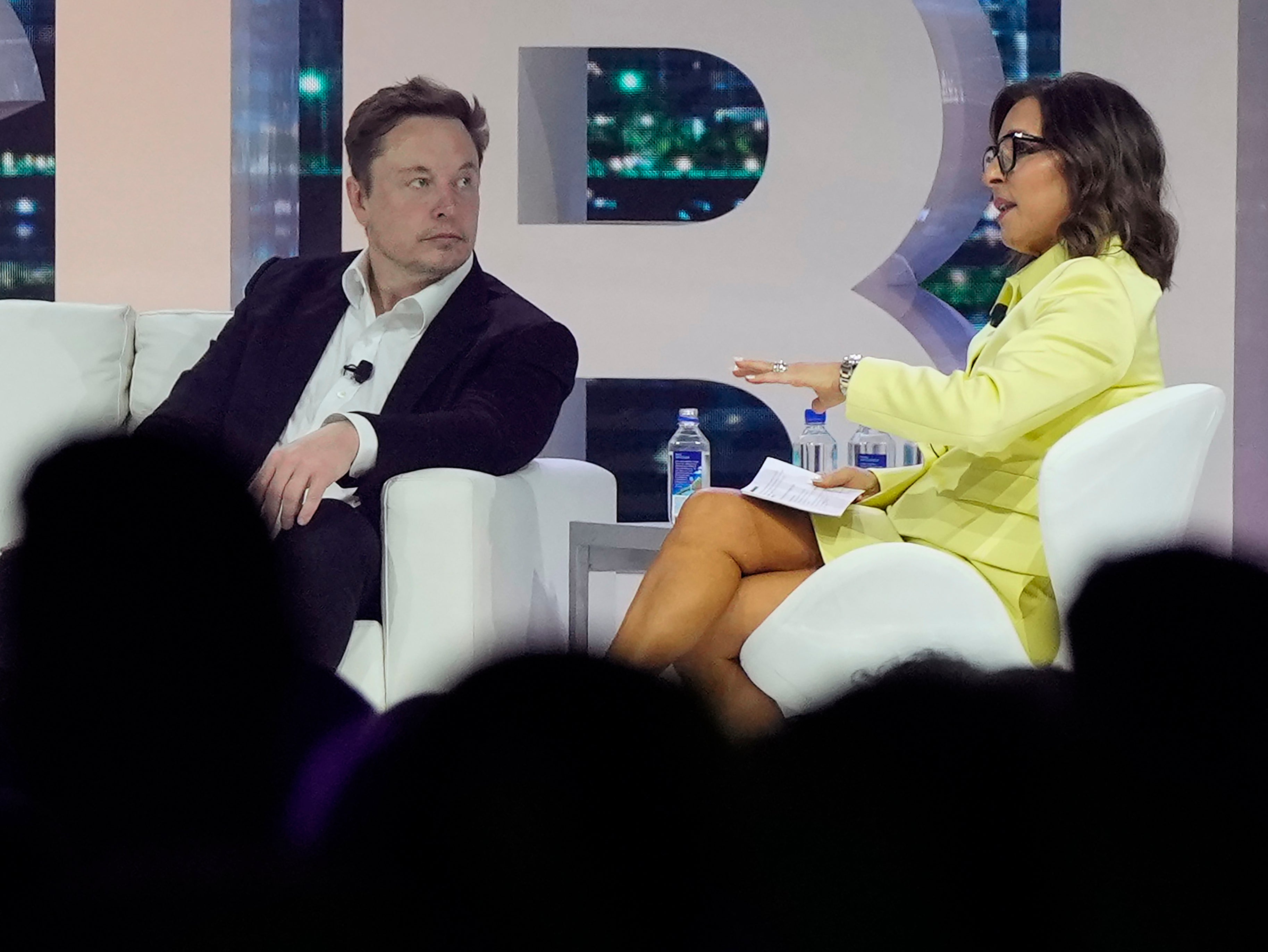 Linda Yaccarino, right, chats with Elon Musk at a conference two months before joining X