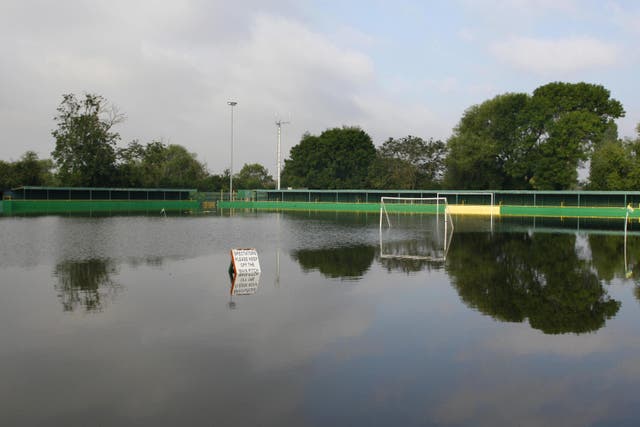 Climate change is threatening to disrupt grassroots sports in the UK by forcing games to be postponed, which could lead to fewer athletes and fans wanting to take part, a report has found (PA)