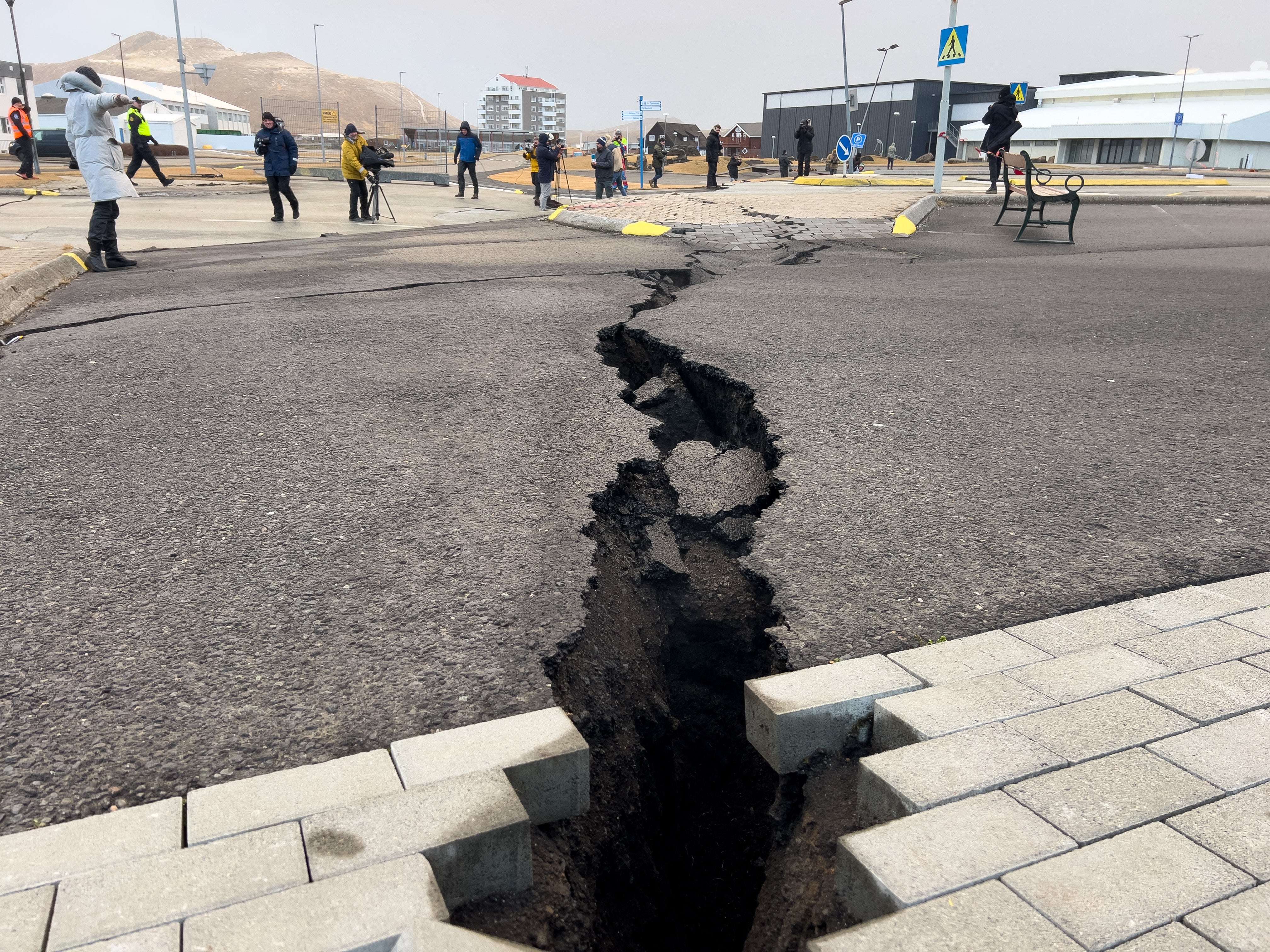 A large crack amid the road after the Icelandic town of Grindavik was shaken by earthquakes... and grammatical horror
