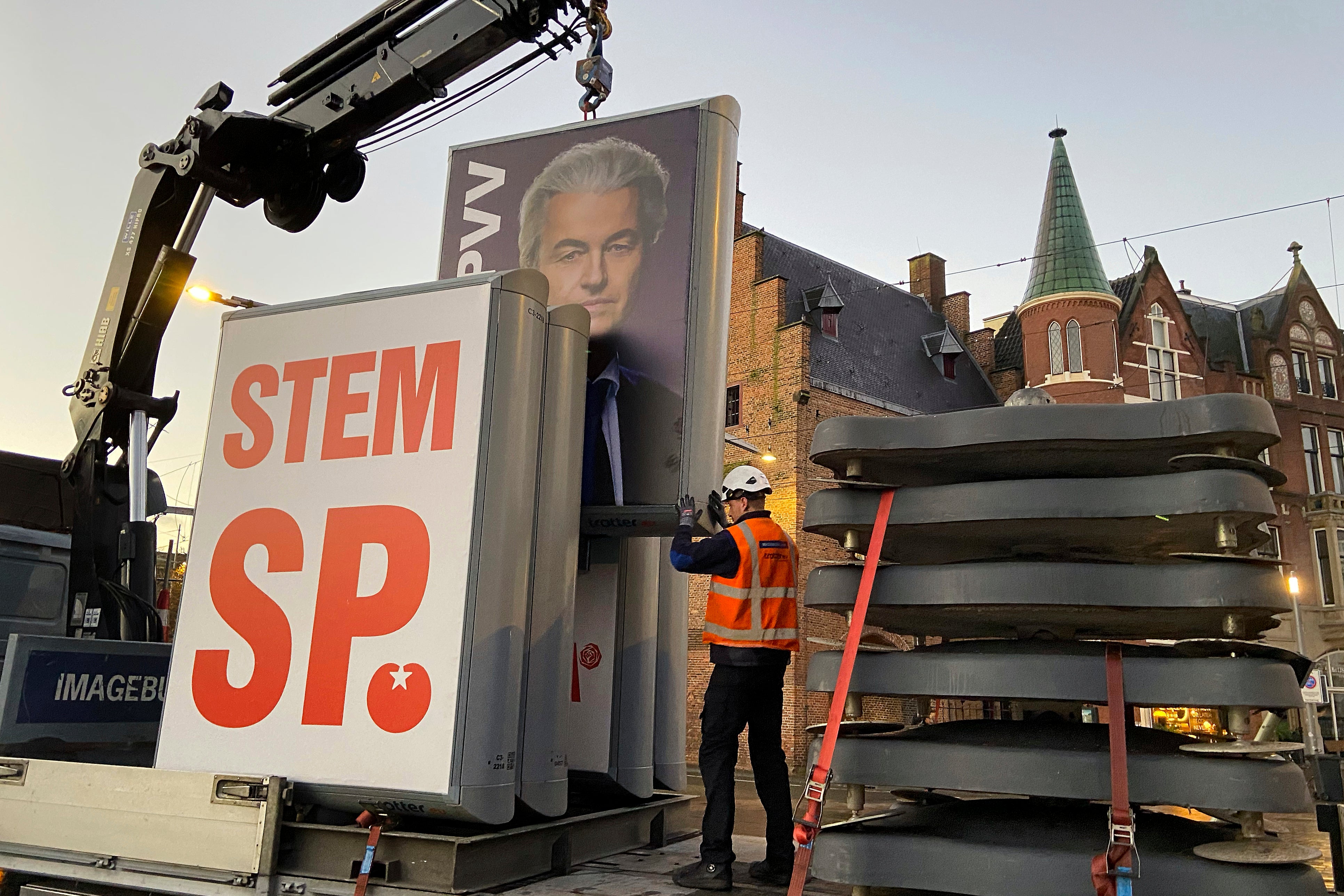 An eclection campaing poster of Geert Wilders' PVV party is removed in The Hague this morning