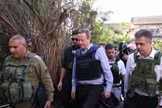 David Cameron visits Israel as Hamas hostage release delayed