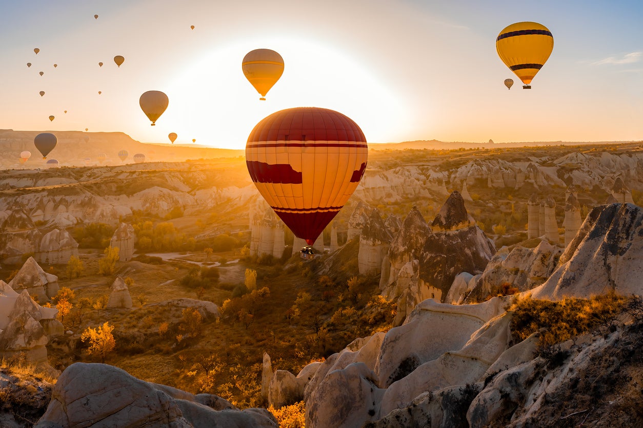 Float over Cappadocia at sunrise for the best views of its surreal tufa formations