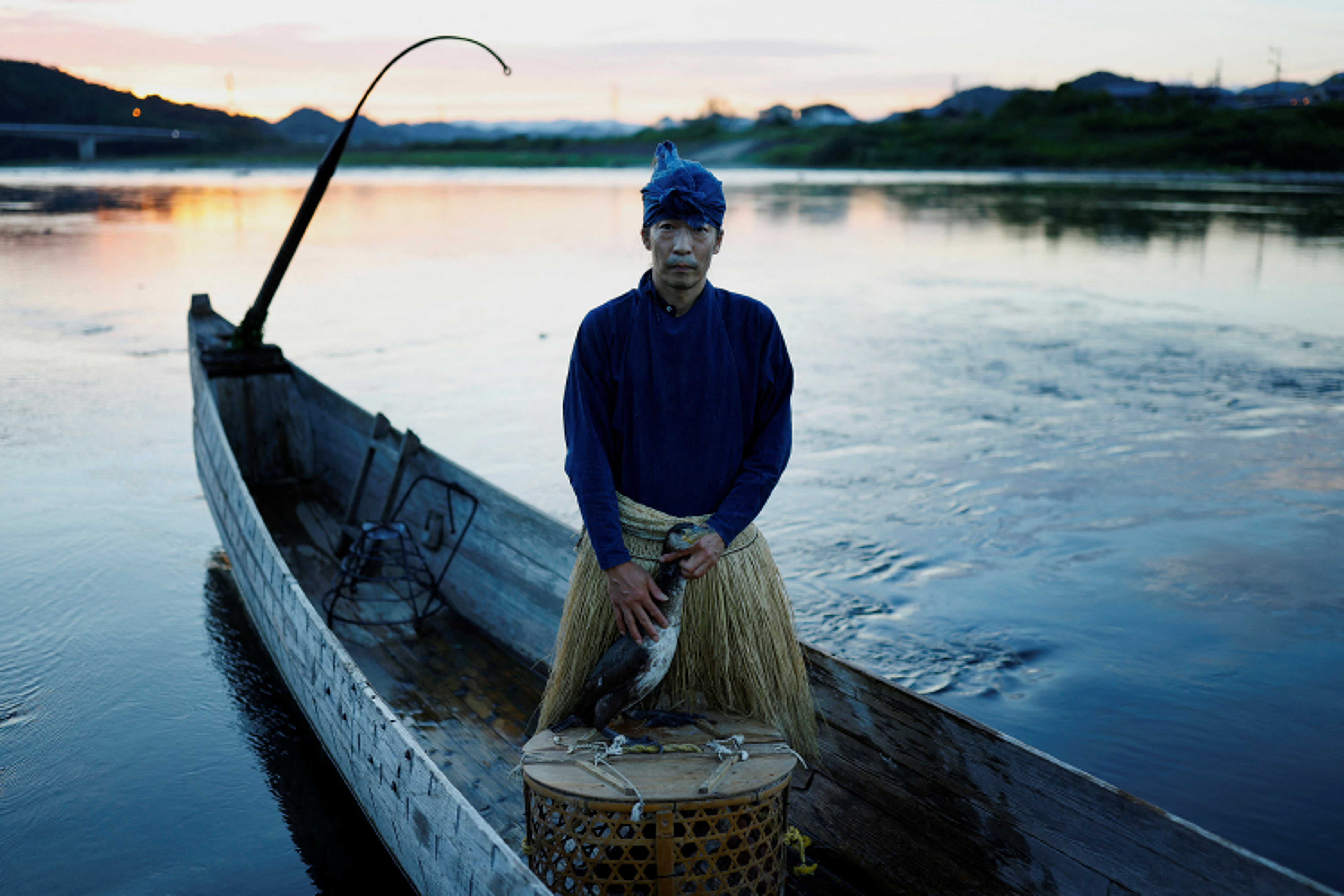 Cormorant fishing master, Youichiro Adachi, 48, on the Nagara River in Oze, Seki, Japan.