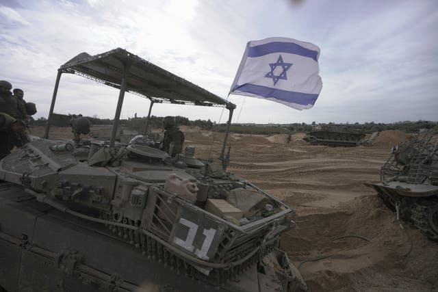 Israeli soldiers have been pushing into the Gaza strip (Victor R Caivano/PA)