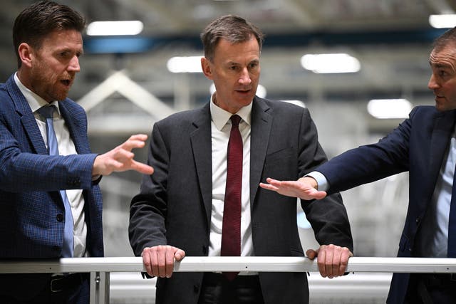 <p>Jeremy Hunt is shown an Airbus A350 wing being made at an aircraft plant in Broughton near Chester on Thursday</p>