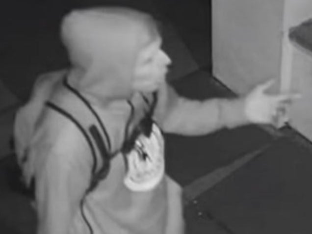 Black-and-white CCTV image of suspect