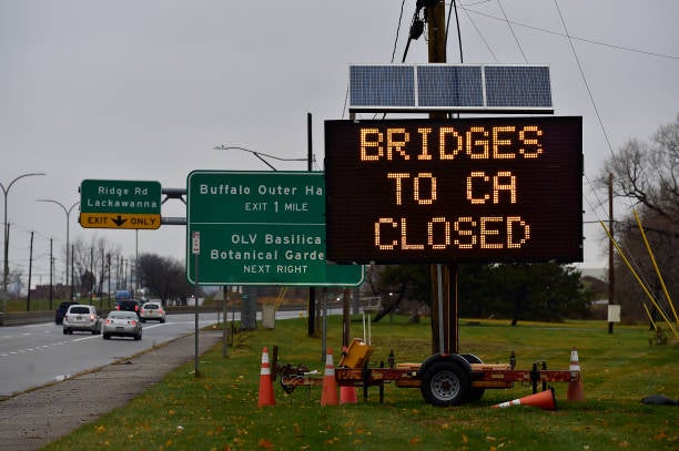 A sign indicates that all bridges between the US and Canada are closed after a car crashed and exploded at The Rainbow Bridge on 22 November 2023