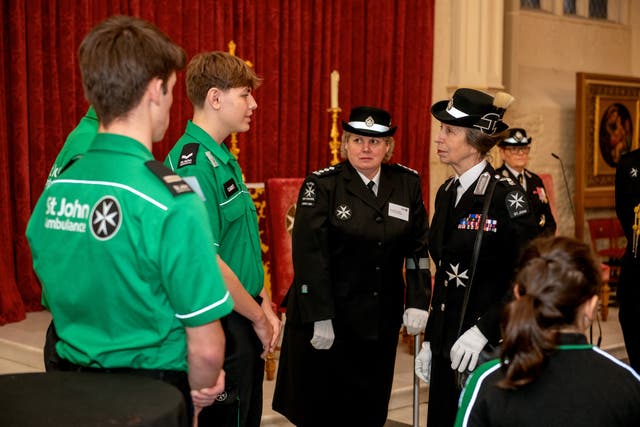 16-year-old lifesaver Joshua Youngs (middle left) meets the Princess Royal (Brian Aldrich/PA)