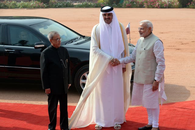 <p>File image: Indian Prime Minister Narendra Modi (R) shakes hands with Emir of the State of Qatar Sheikh Tamim Bin Hamad Al-Thani (C) during a ceremonial reception in New Delhi on 25 March 2015</p>