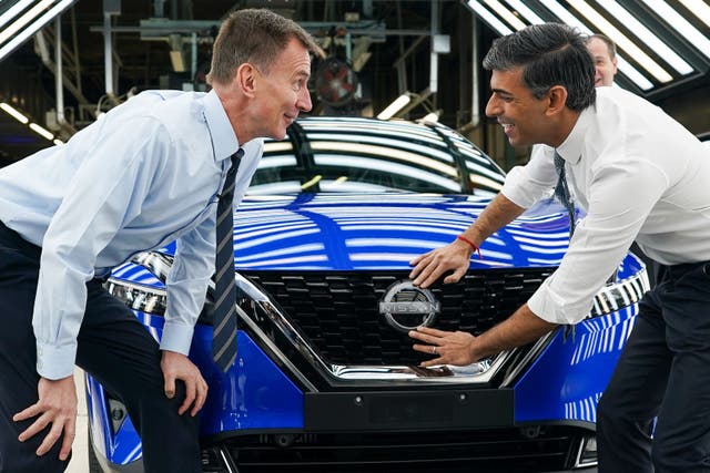 Prime Minister Rishi Sunak and Chancellor of the Exchequer Jeremy Hunt visit the Nissan plant after it announced major investment securing thousands of jobs (Ian Forsyth/PA)