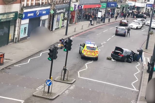 Armed officers approaching Sudesh Amman during the incident (Metropolitan Police/PA)