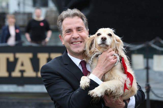 Dan Norris celebrating with his dog Angel after being elected West of England mayor (West of England Combined Authority/PA)