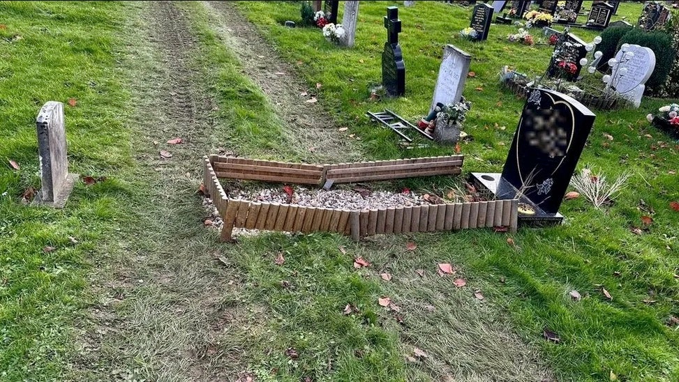 A grave damaged by track marks