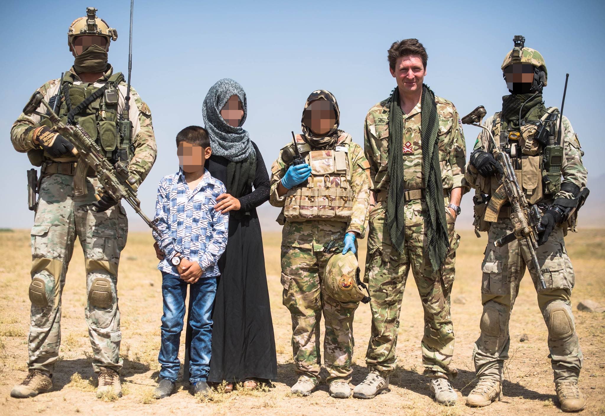 Major General Charlie Herbert (second right) with a female member of the Triples unit