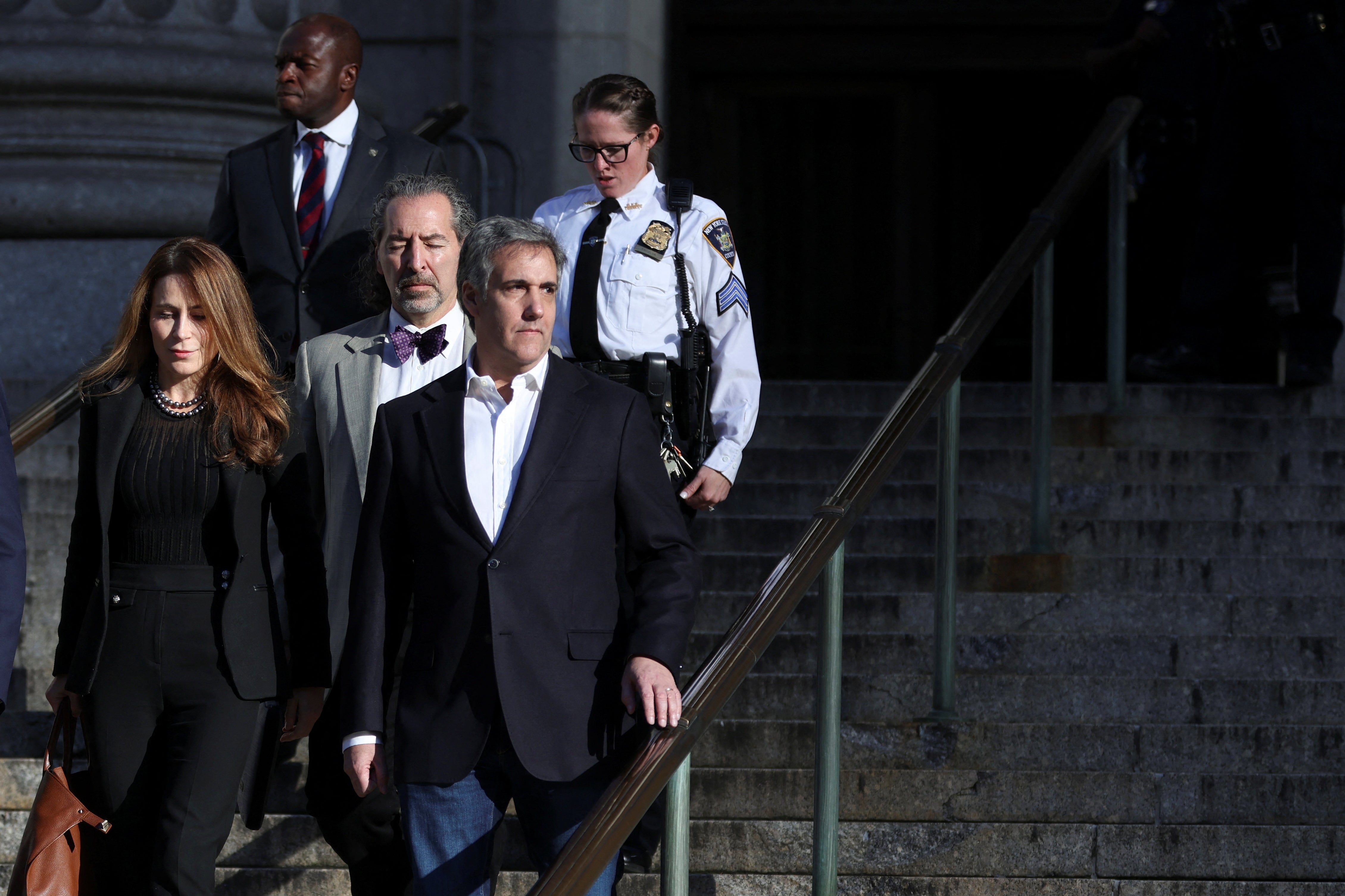Michael Cohen leaves a civil fraud trial at New York County Supreme Court on 25 October, 2023.