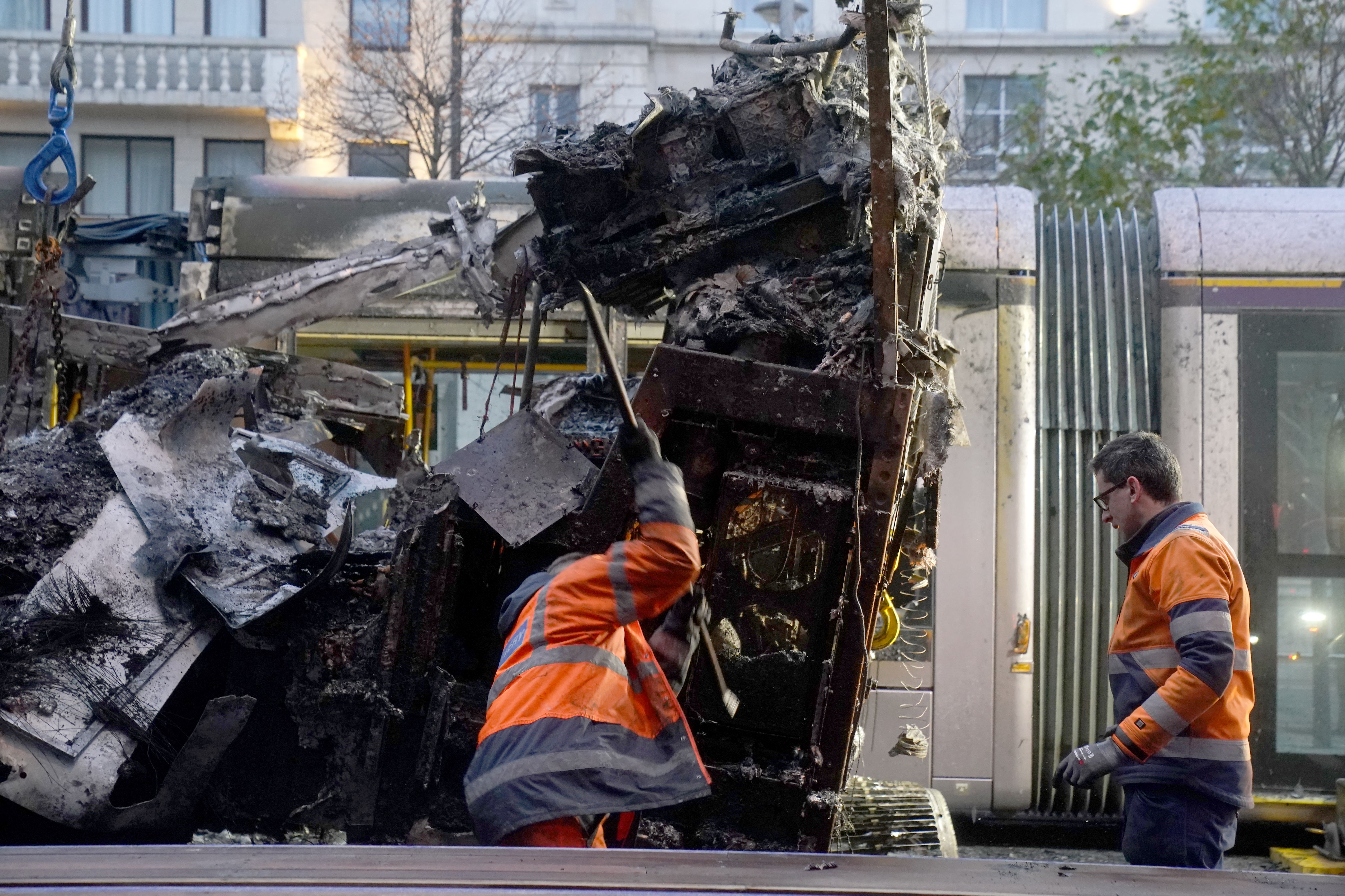 A burned-out bus is removed from O’Connell Street in Dublin, in the aftermath of violent scenes in the city centre on Thursday