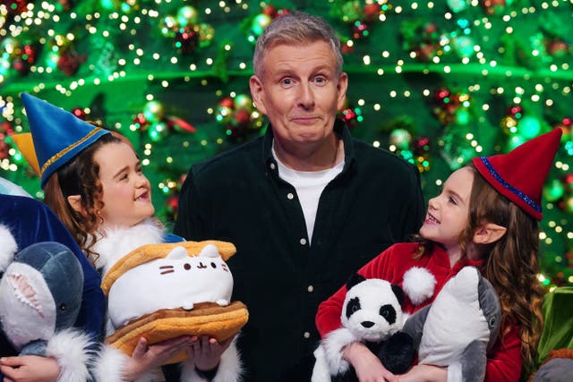 Host of The Late Late Show Patrick Kielty with (from left) Poppy Madden, six, from Carlow, and Darcy Ramsbottom, six, from Carlow, at the unveiling of the theme and set for The Late Late Toy Show at the RTE studios in Dublin (Brian Lawless/PA)