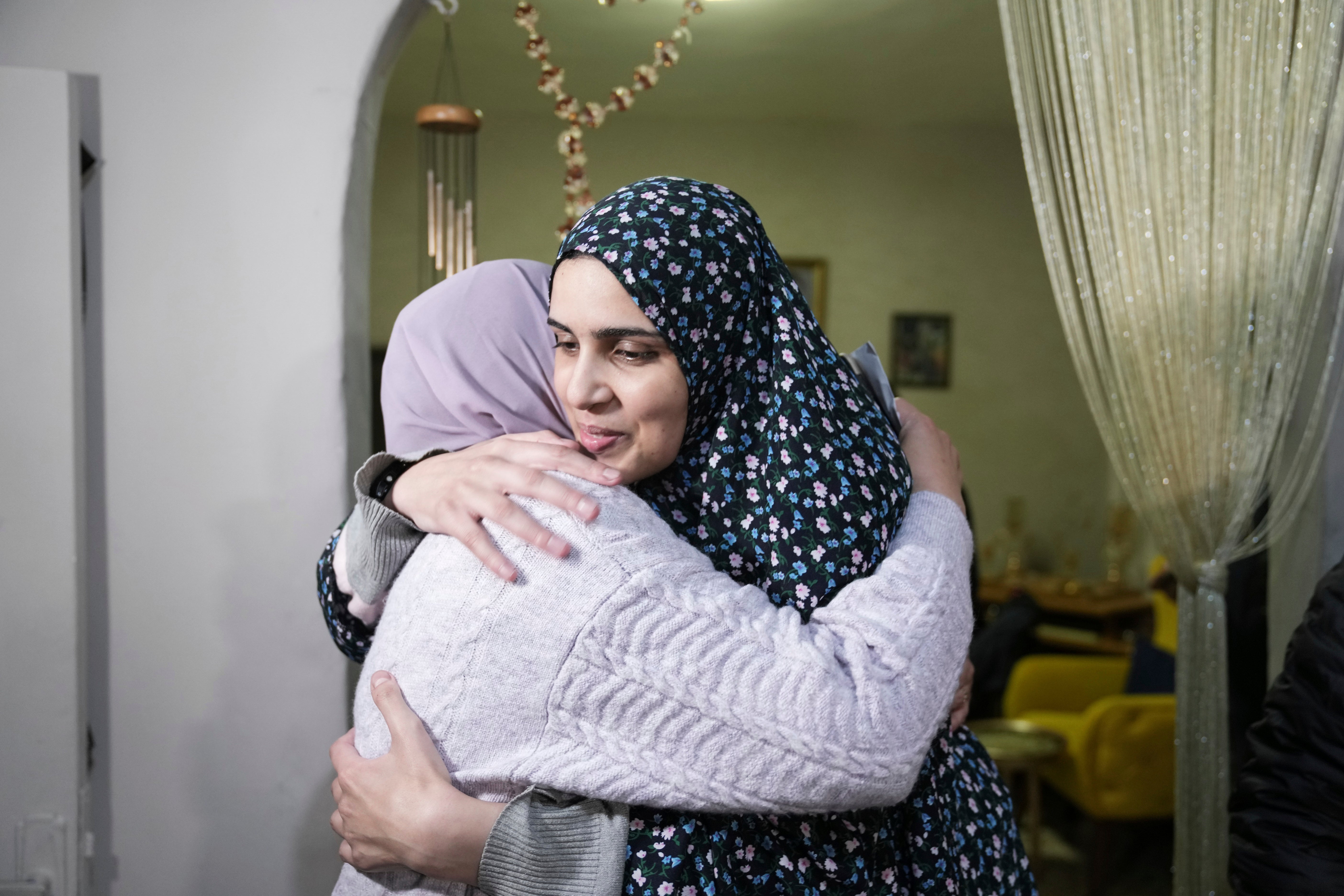 Marah Bakir, right, a former Palestinian prisoner who was released by the Israeli authorities, is welcomed at her family house in the east Jerusalem neighbourhood of Beit Hanina