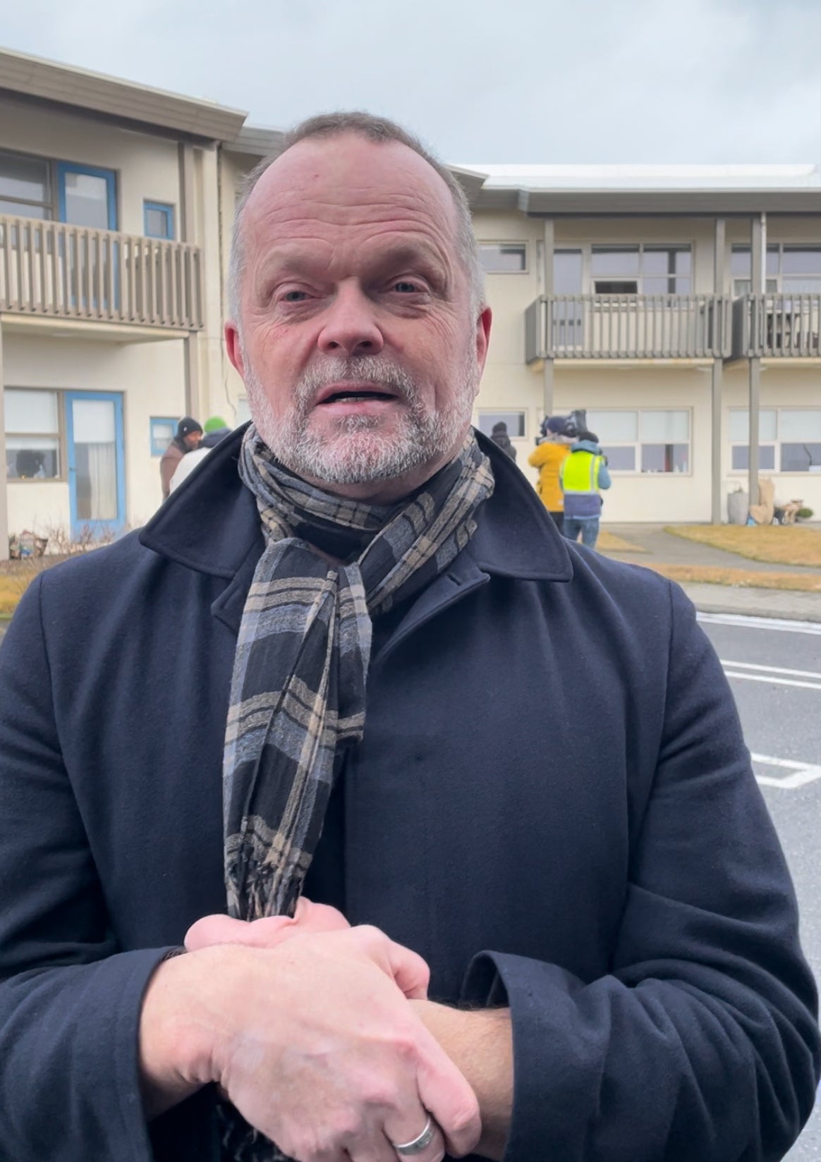 Snorri Valsson, Iceland’s spokesperson for tourism, stands in front of a retirement home damaged by the earthquake
