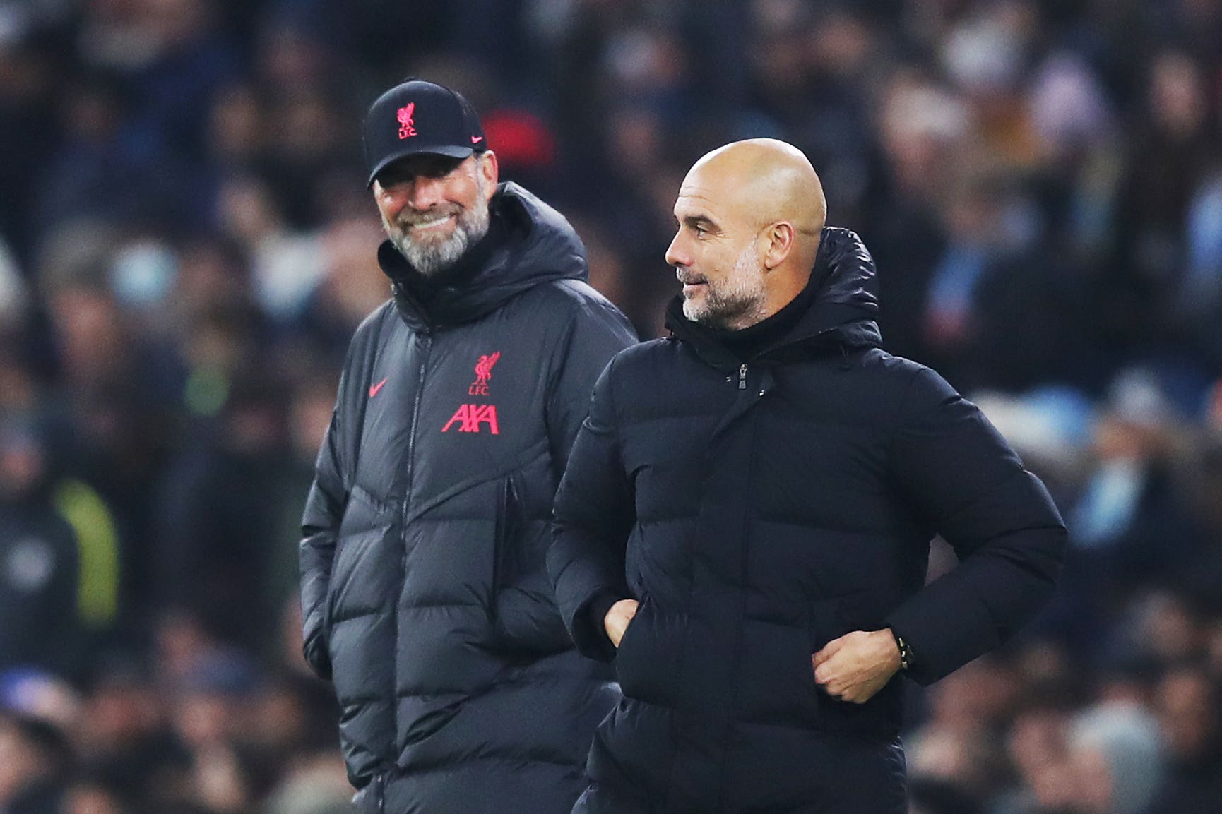 Manchester City manager Pep Guardiola, right, and Liverpool boss Jurgen Klopp meet on Sunday