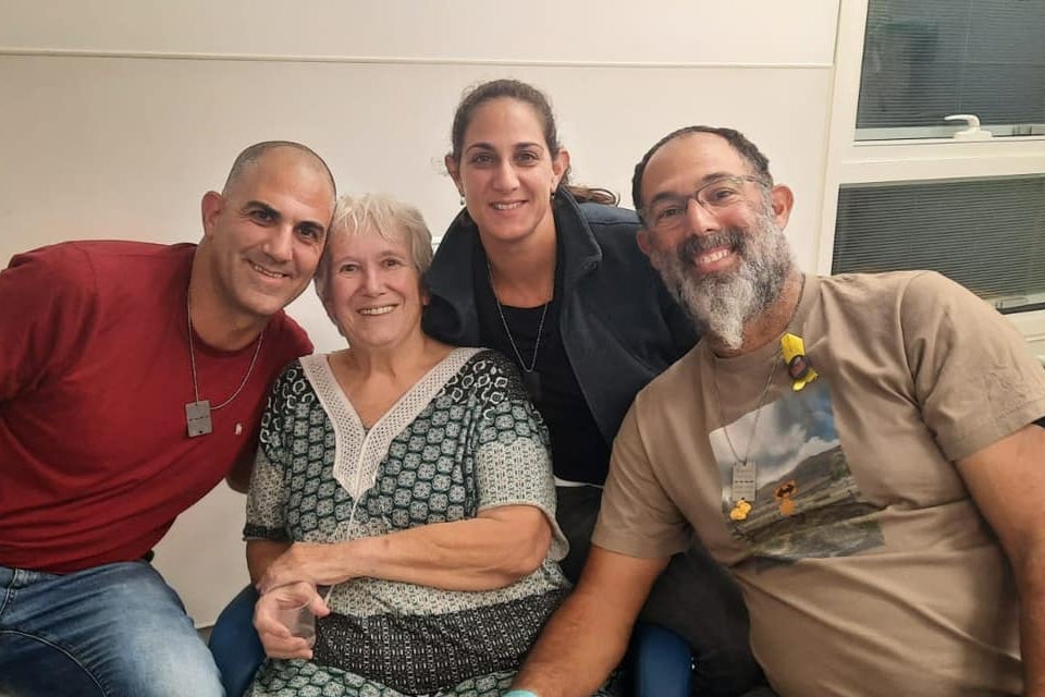 <p>Margalit Moses, 78, poses with her family after being released by Hamas </p>