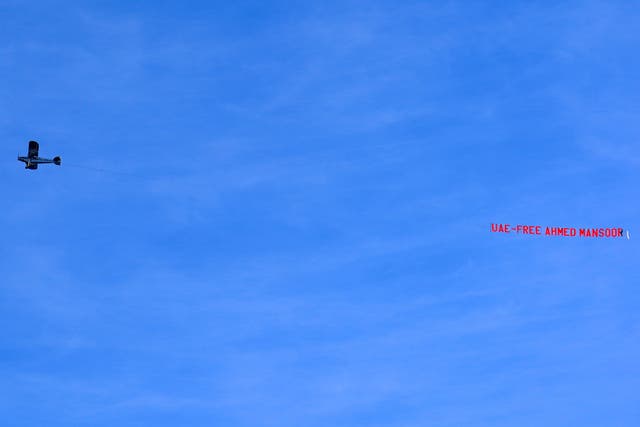 A plane, organised by Amnesty International UK campaigners, carrying a banner reading ‘UAE: Free Ahmed Mansoor’ flies over the Etihad Stadium (Martin Rickett/PA)
