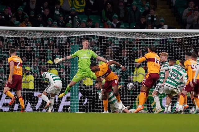 Jonathan Obika heads home late on (Andrew Milligan/PA)