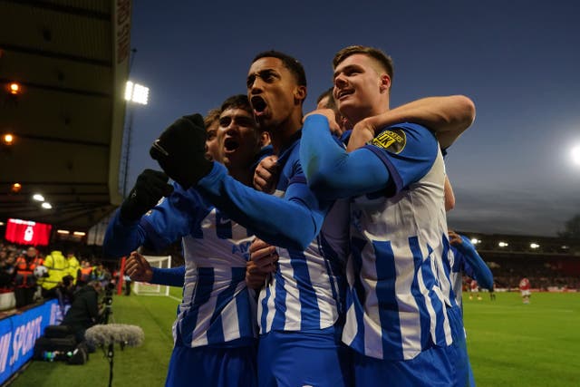 Brighton and Hove Albion’s Joao Pedro (centre) celebrates scoring his sides third goal with Evan Ferguson (right) during the Premier League match at the City Ground, Nottingham. Picture date: Saturday November 25, 2023.