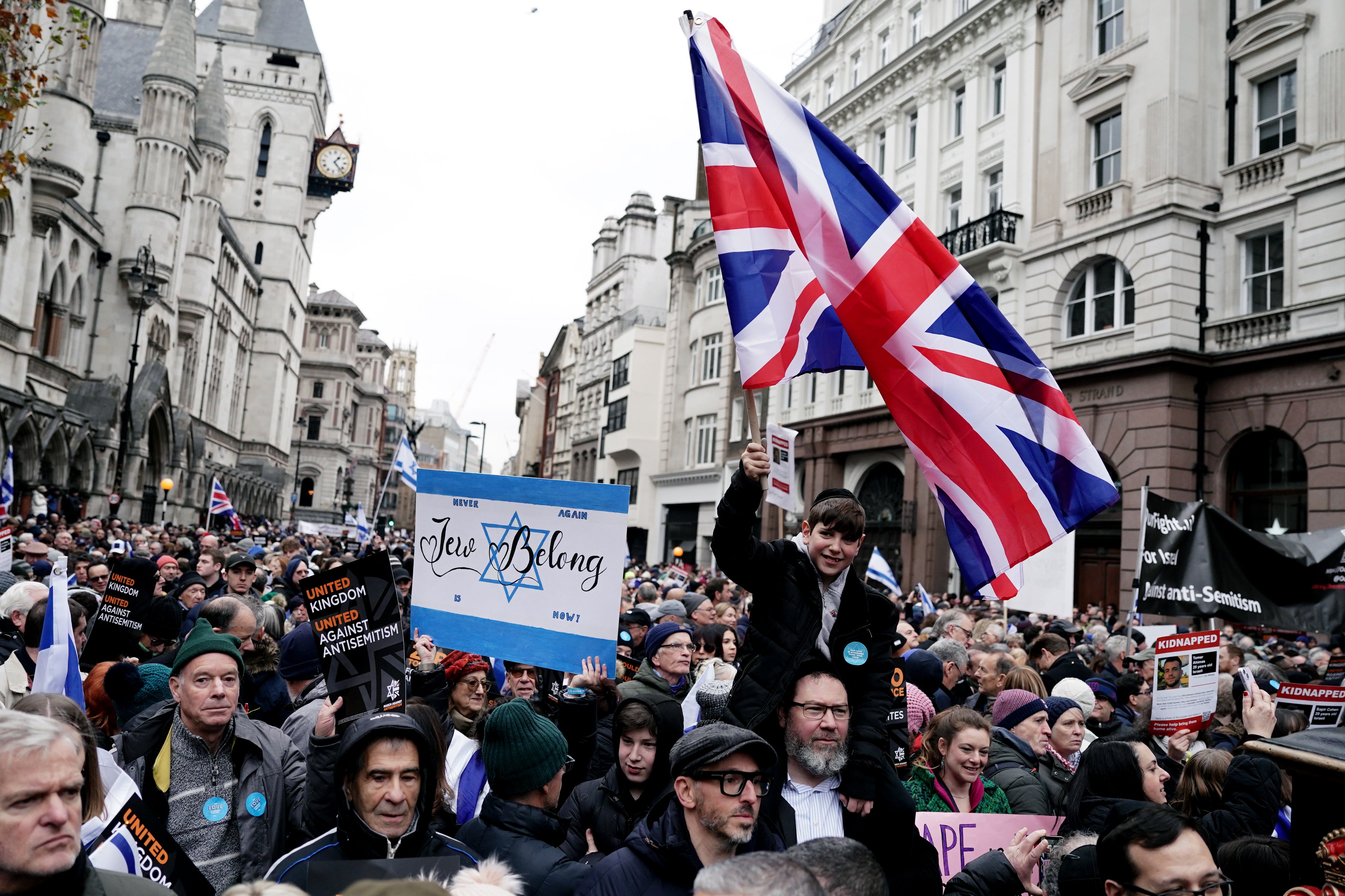 Signs read ‘Jews belong' and ‘United Kingdom against Antisemitism’