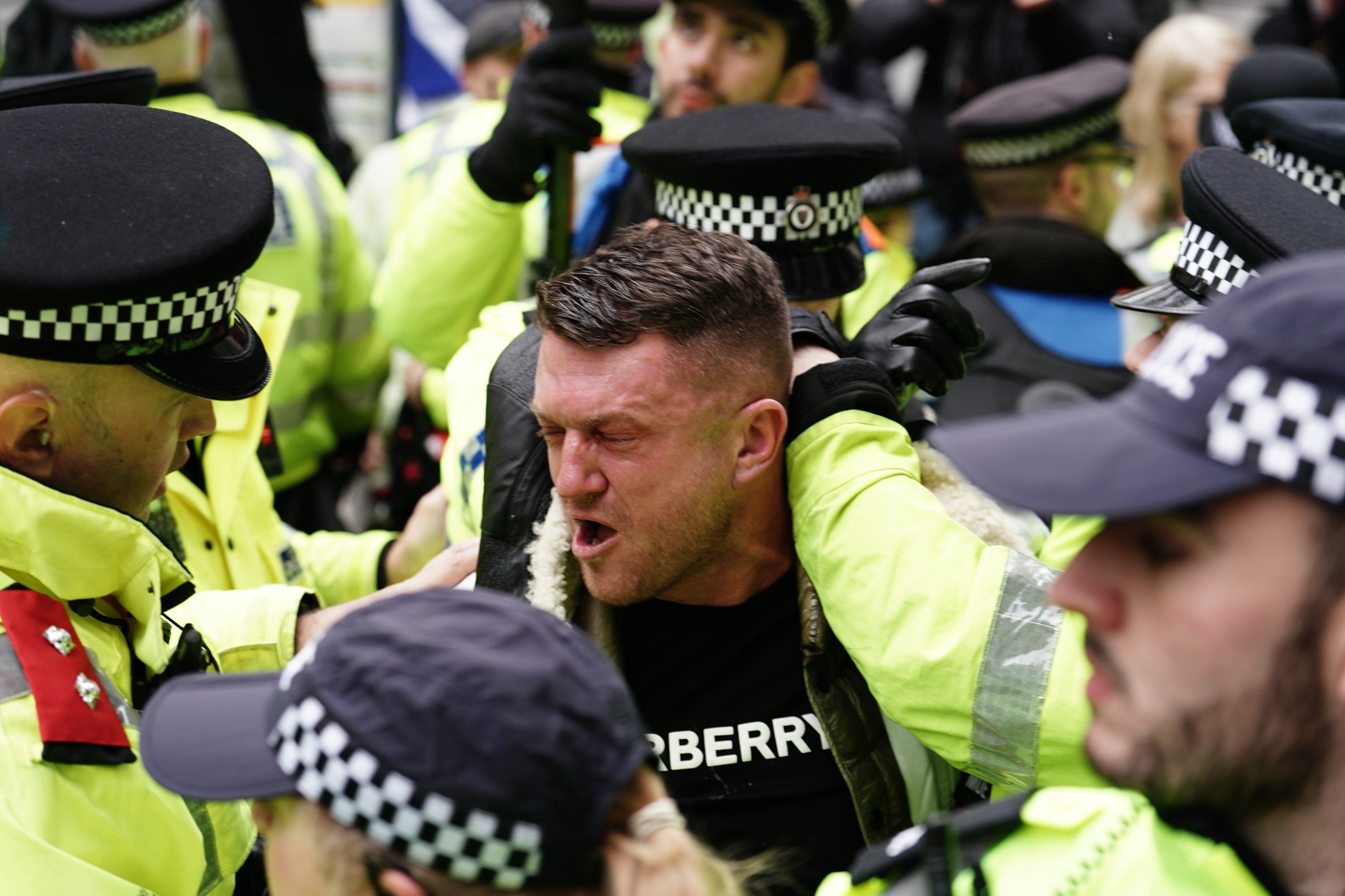 EDL founder Tommy Robinson was prevented from attending the march by several officers
