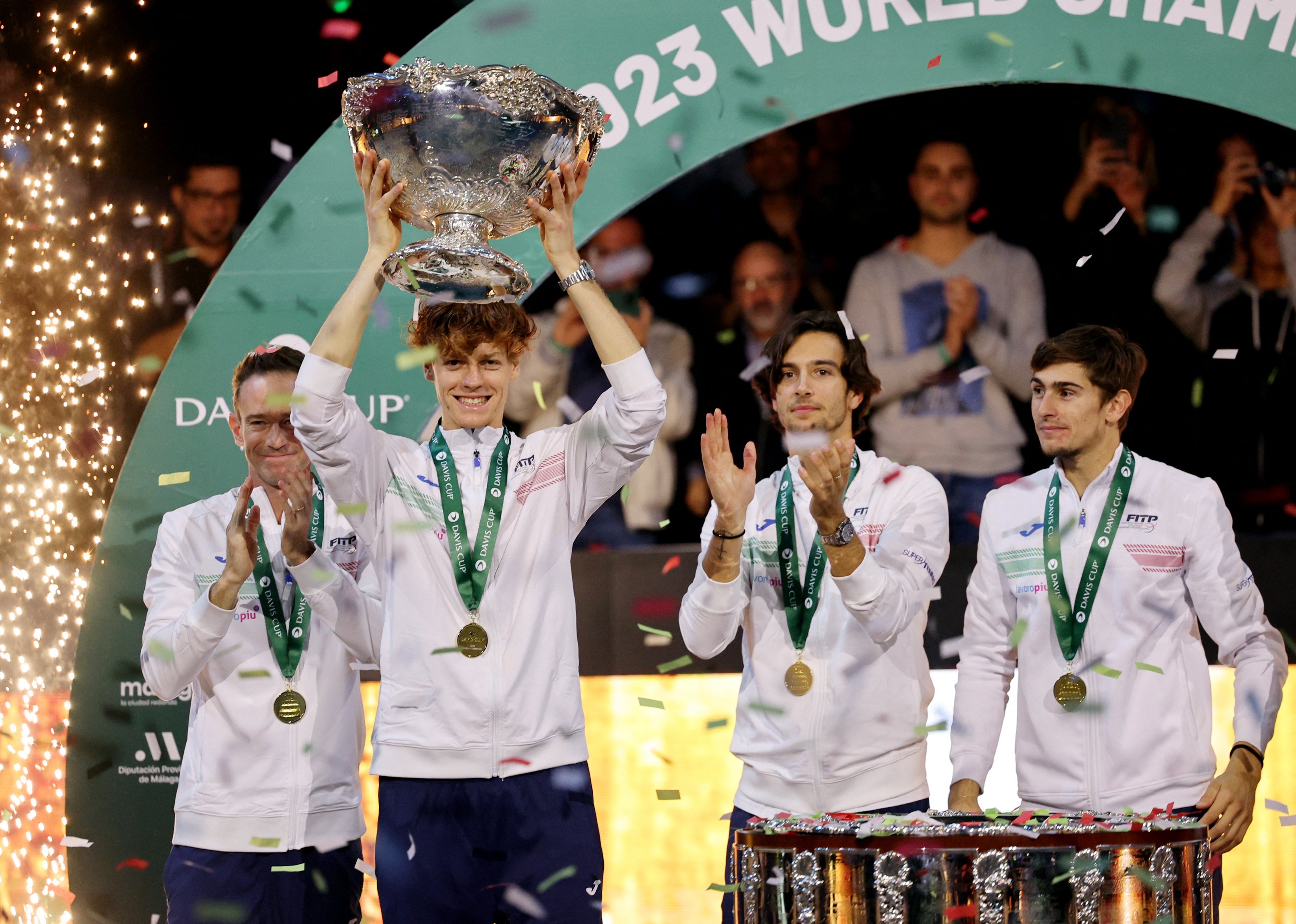 <p>Italy hold aloft the Davis Cup trophy for the first time in 47 years</p>