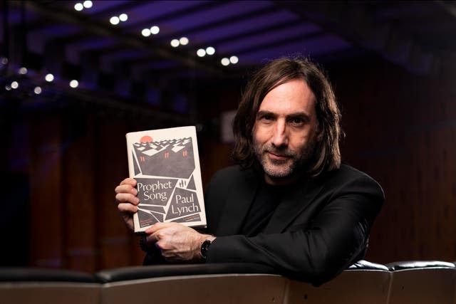 <p>Booker Prize 2023 winner Paul Lynch with his novel, Prophet Song </p>