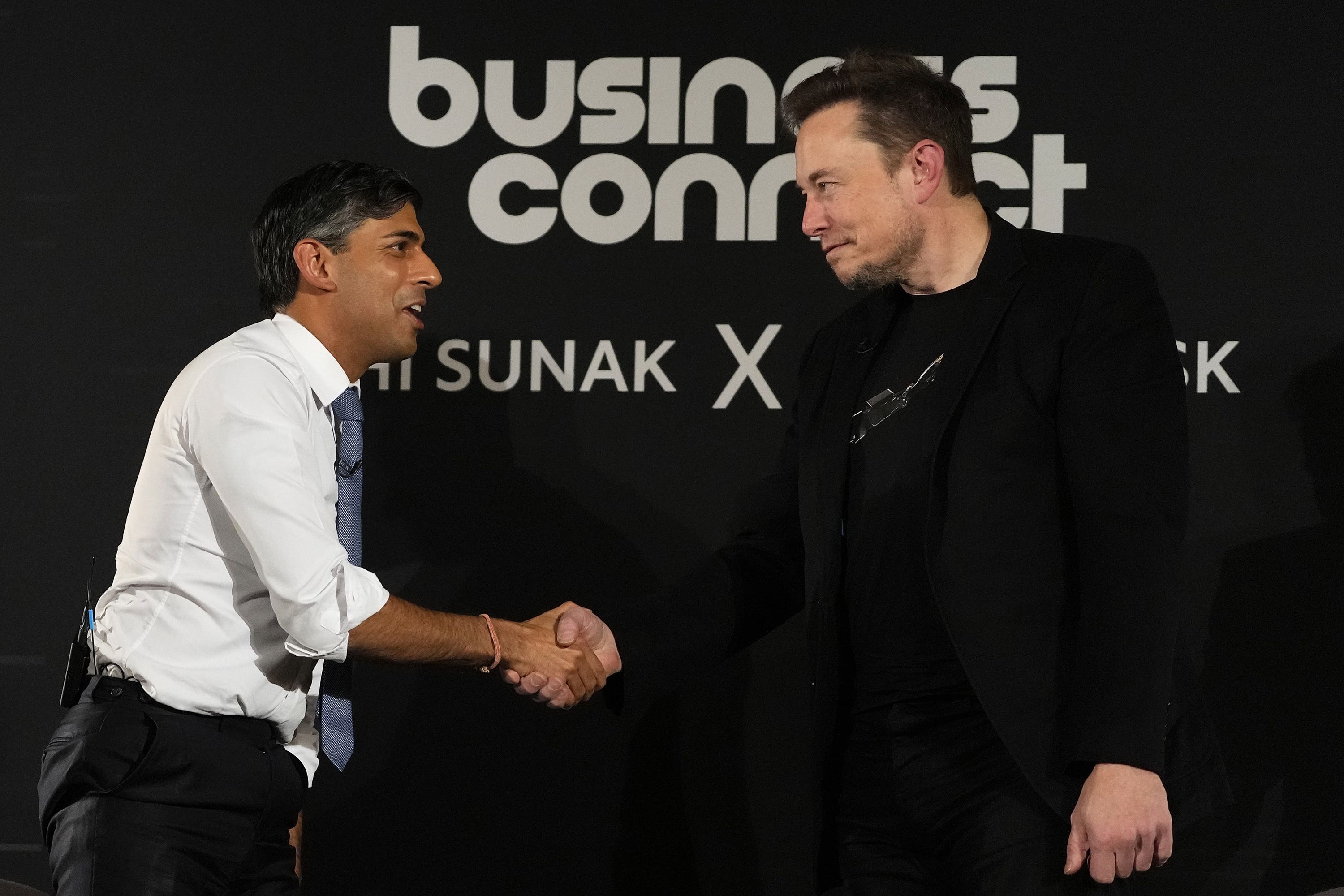 Prime Minister Rishi Sunak shakes hands with Elon Musk