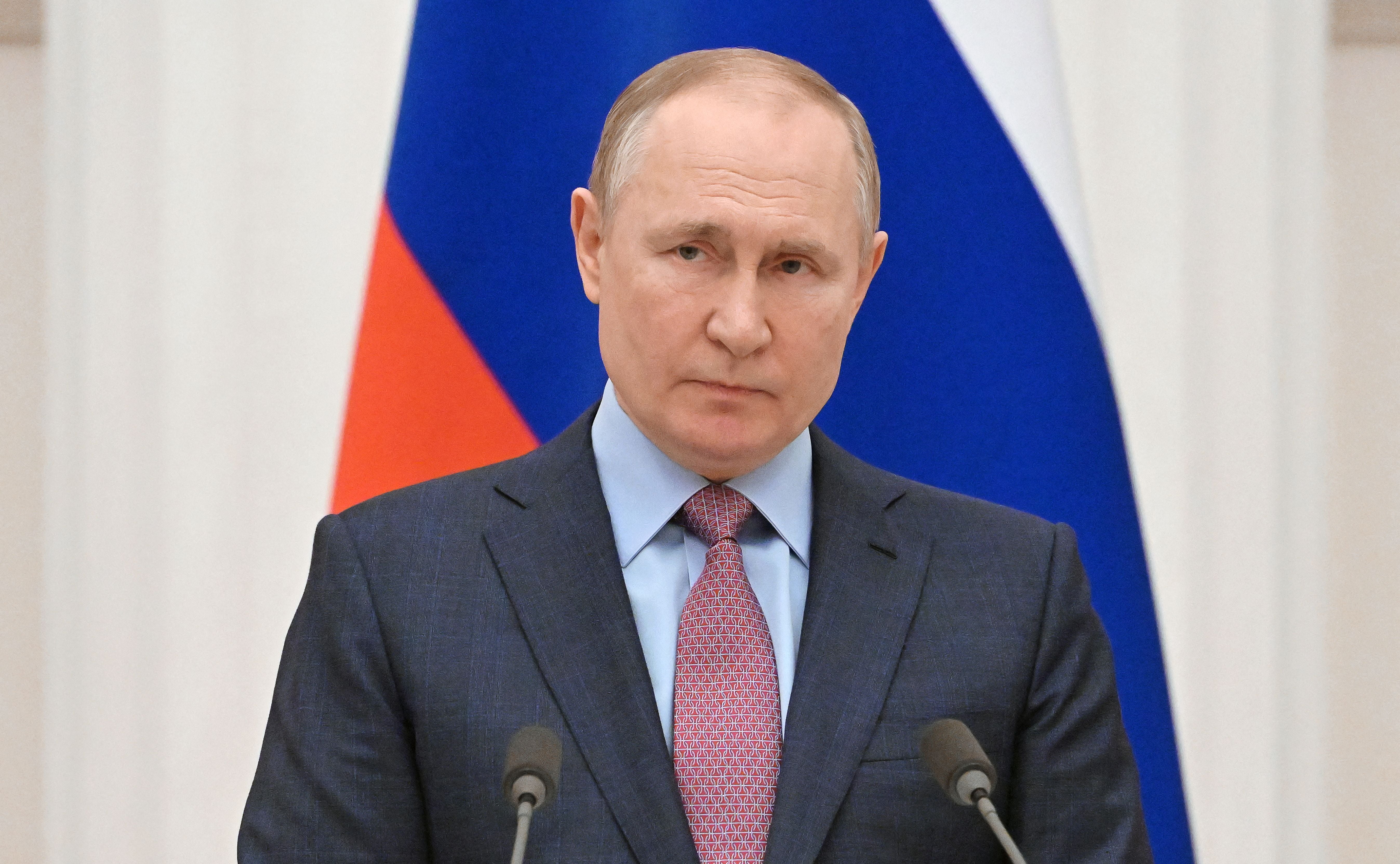 Russia’s President Vladimir Putin attends a press conference with his Belarus counterpart, following their talks at the Kremlin in Moscow on February 18, 2022