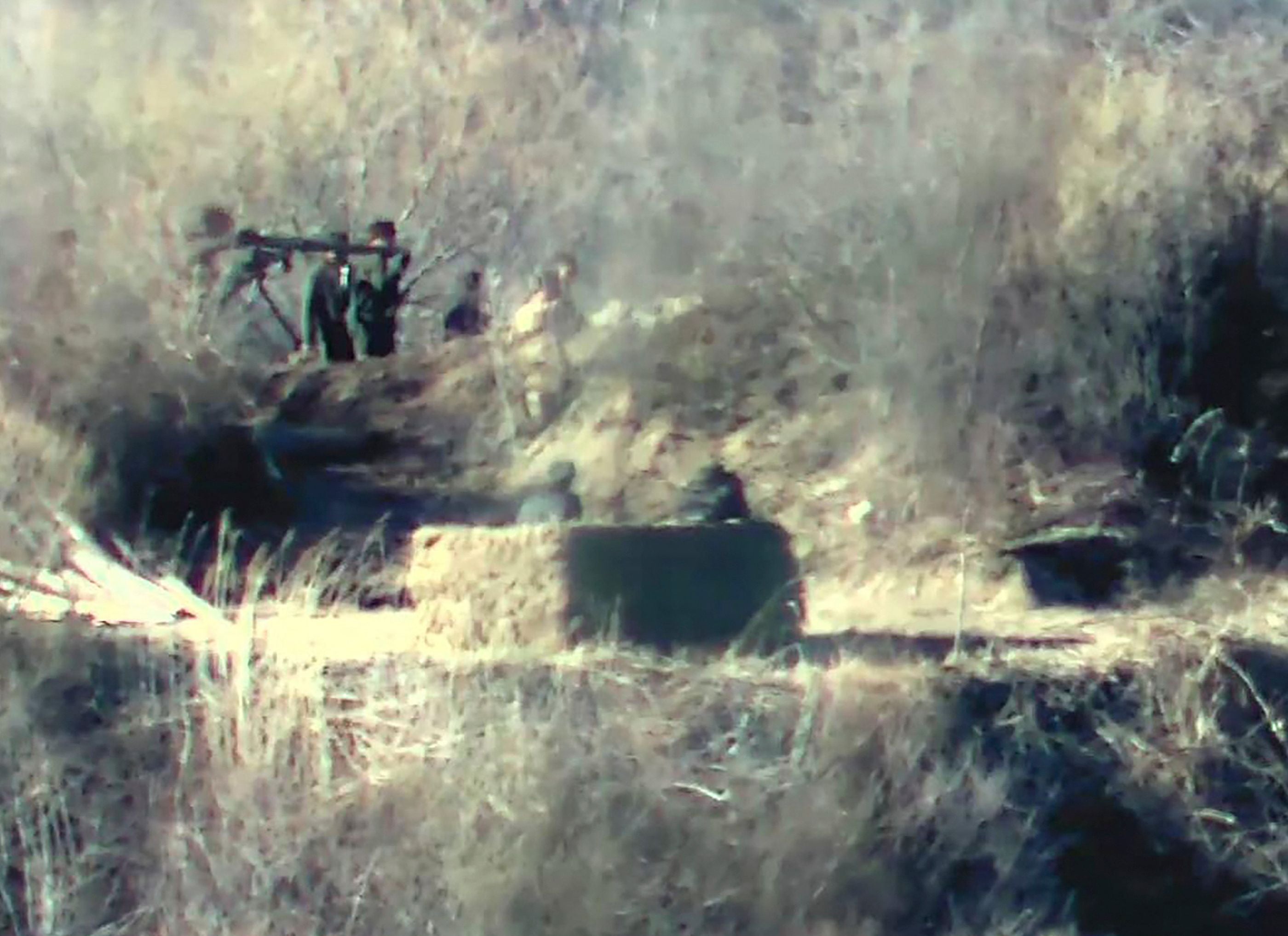 This undated handout photo released on November 27, 2023 by the South Korean Defence Ministry shows North Korean soldiers near a guard post on the North side of the Demilitarised zone (DMZ) dividing the two Koreas