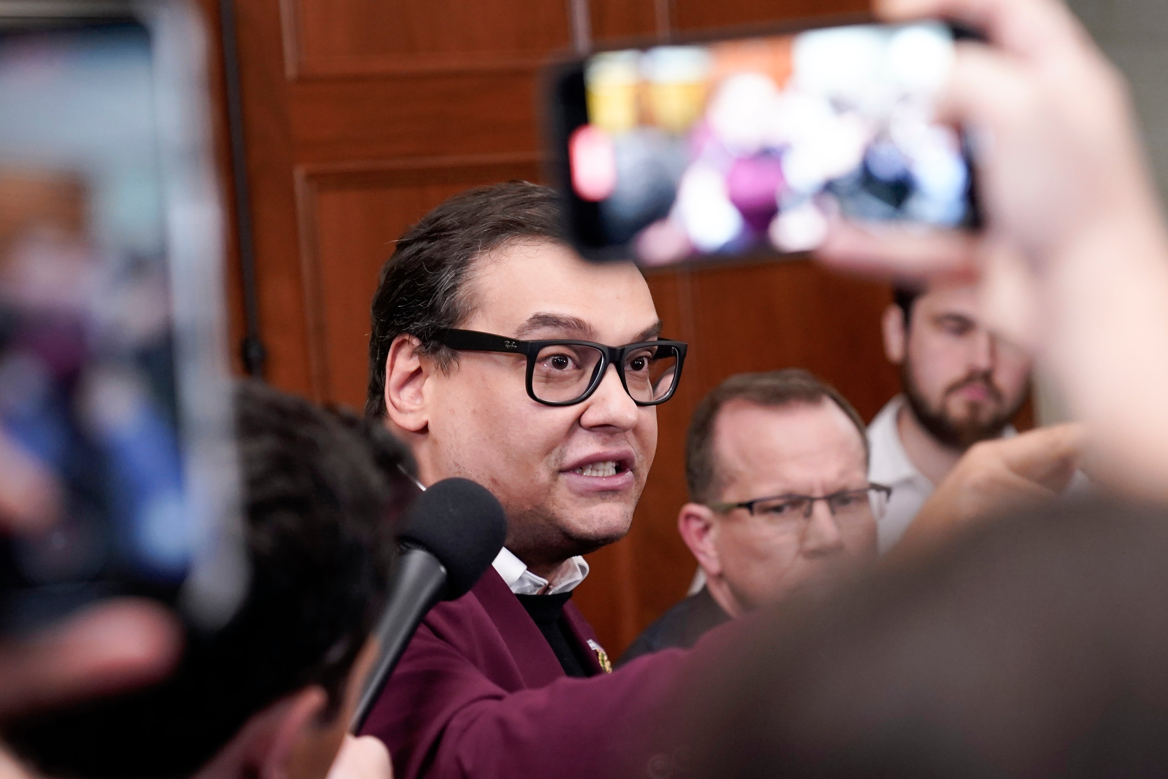 Rep. George Santos, R-N.Y., talks to reporters as House Republicans hold a caucus meeting at the Capitol in Washington, Friday, Oct. 13, 2023