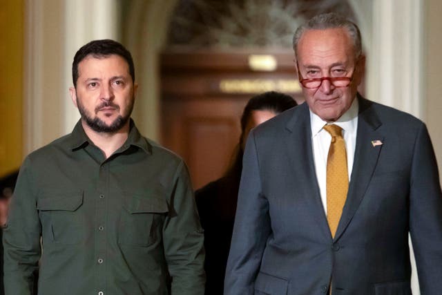 <p>Ukrainian President Volodymyr Zelensky walks with Senate Majority Leader Chuck Schumer of N.Y. at Capitol Hill on Thursday, Sept. 21, 2023, in Washington</p>