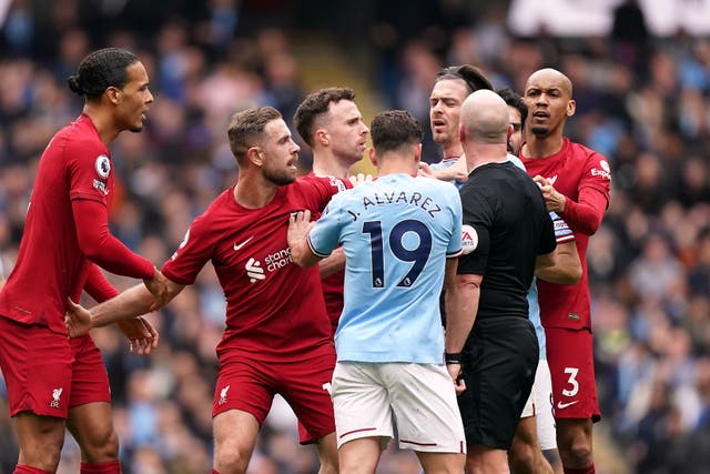 The IFAB is set to commission trials to stop players surrounding referees (Mike Egerton/PA)