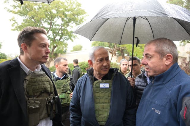 <p> In this handout image provided by the GPO, Israel's Prime Minister Benjamin Netanyahu (C) takes Elon Musk (L) on a tour of Kibbutz Kfar Aza after the October 7th Massacre took place there, on November 27, 2023 in Kfar Aza, Israel. </p>