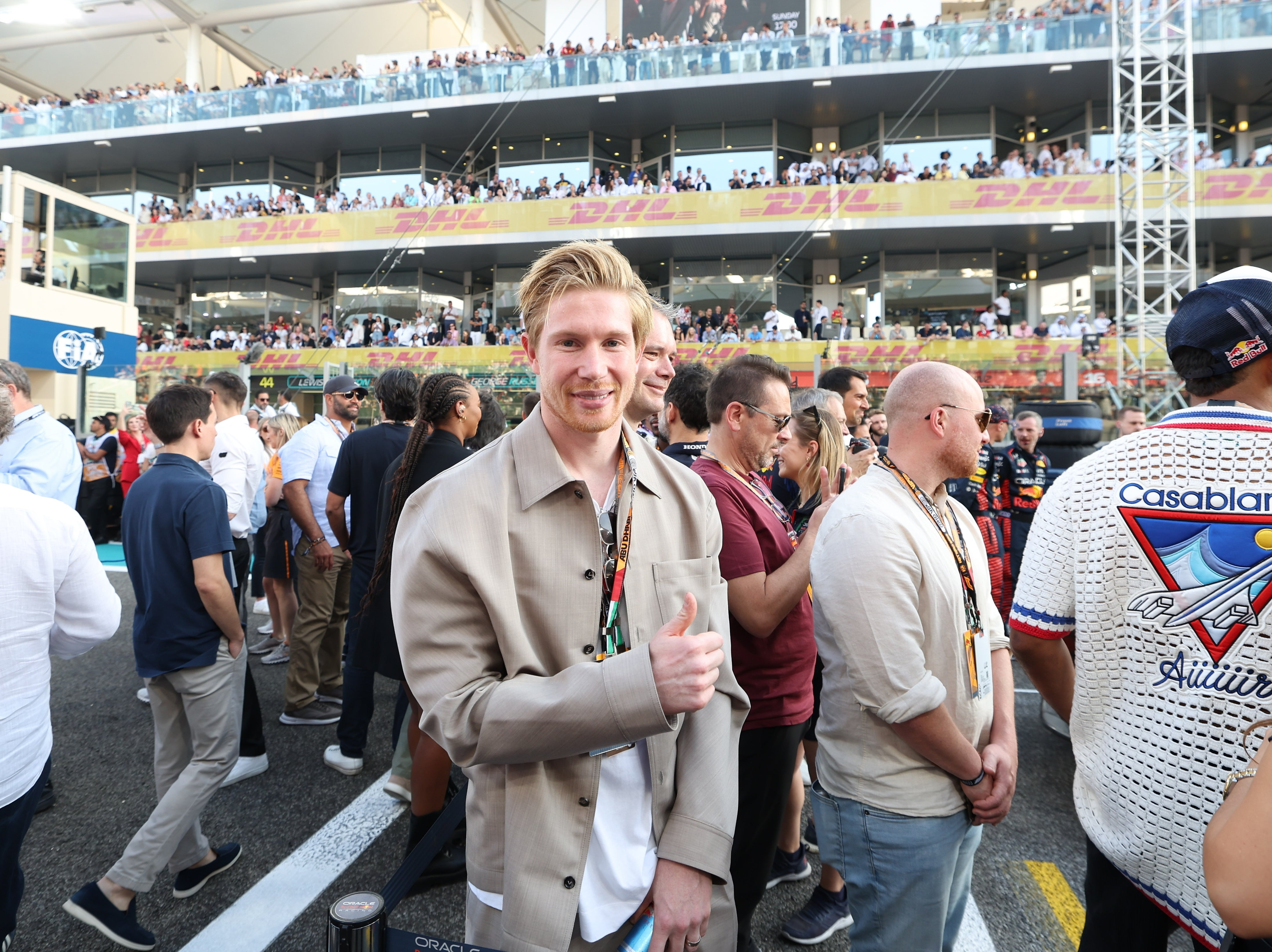 Belgian soccer player Kevin De Bruyne poses for a photo in the starting grid prior the Formula 1 Abu Dhabi Grand Prix