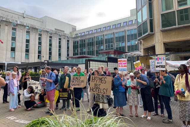 People gathered outside Brighton Town Hall in June in support of Brighton and Hove City Council’s plan to launch legal action against the Home Office for reopening a hotel where more than 100 unaccompanied asylum-seeking children went missing (PA)