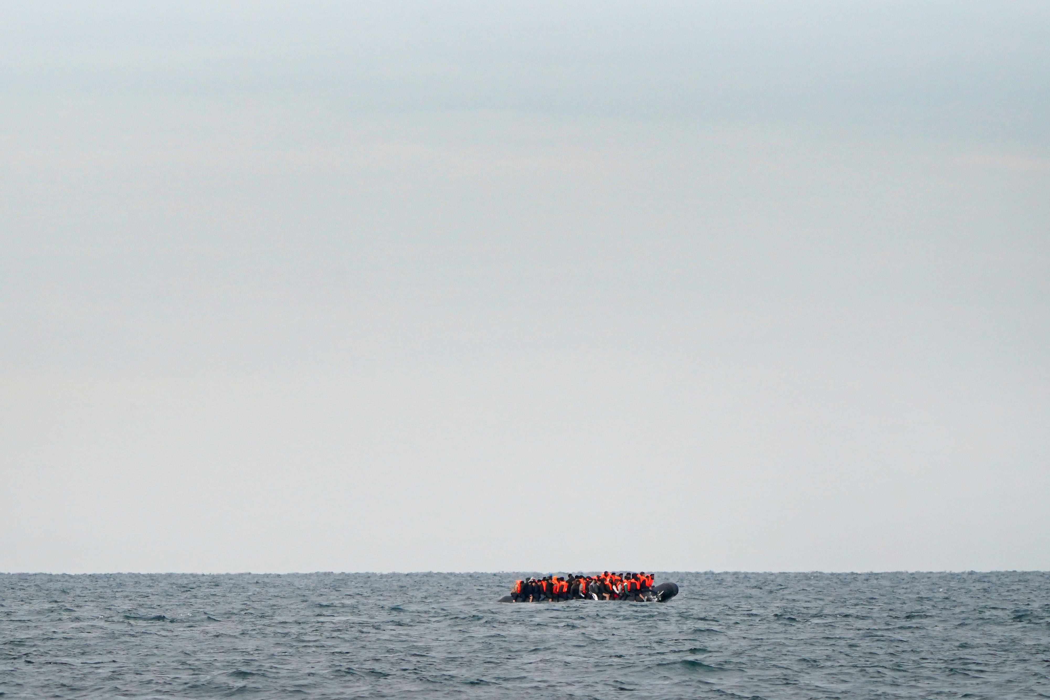 A group of people thought to be migrants crossing the Channel in a small boat travelling from the coast of France and heading in the direction of Dover, Kent (Gareth Fuller/PA)