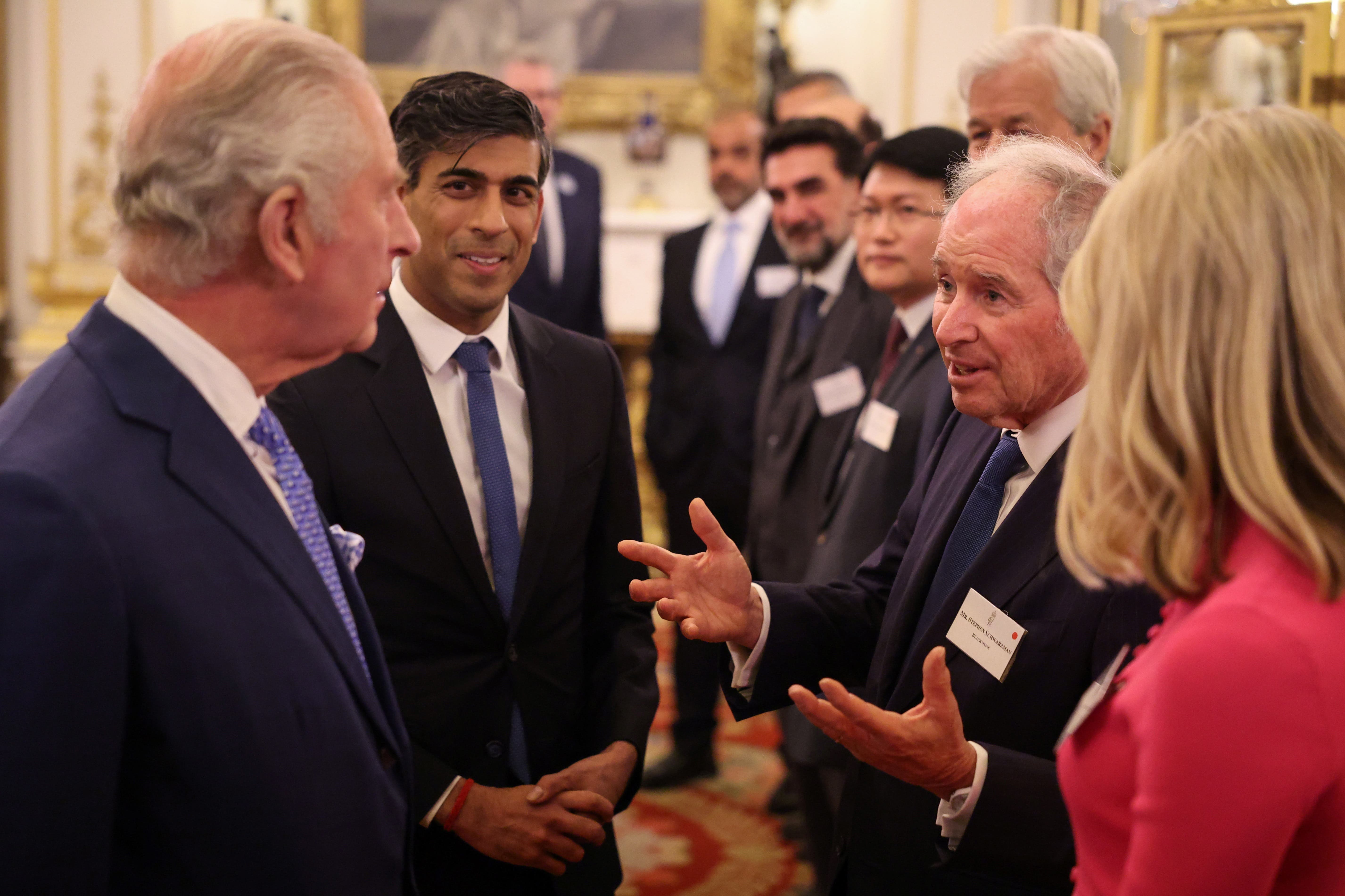 The King and Prime Minister Rishi Sunak meet guests during a reception at Buckingham Palace (Daniel Leal/PA)