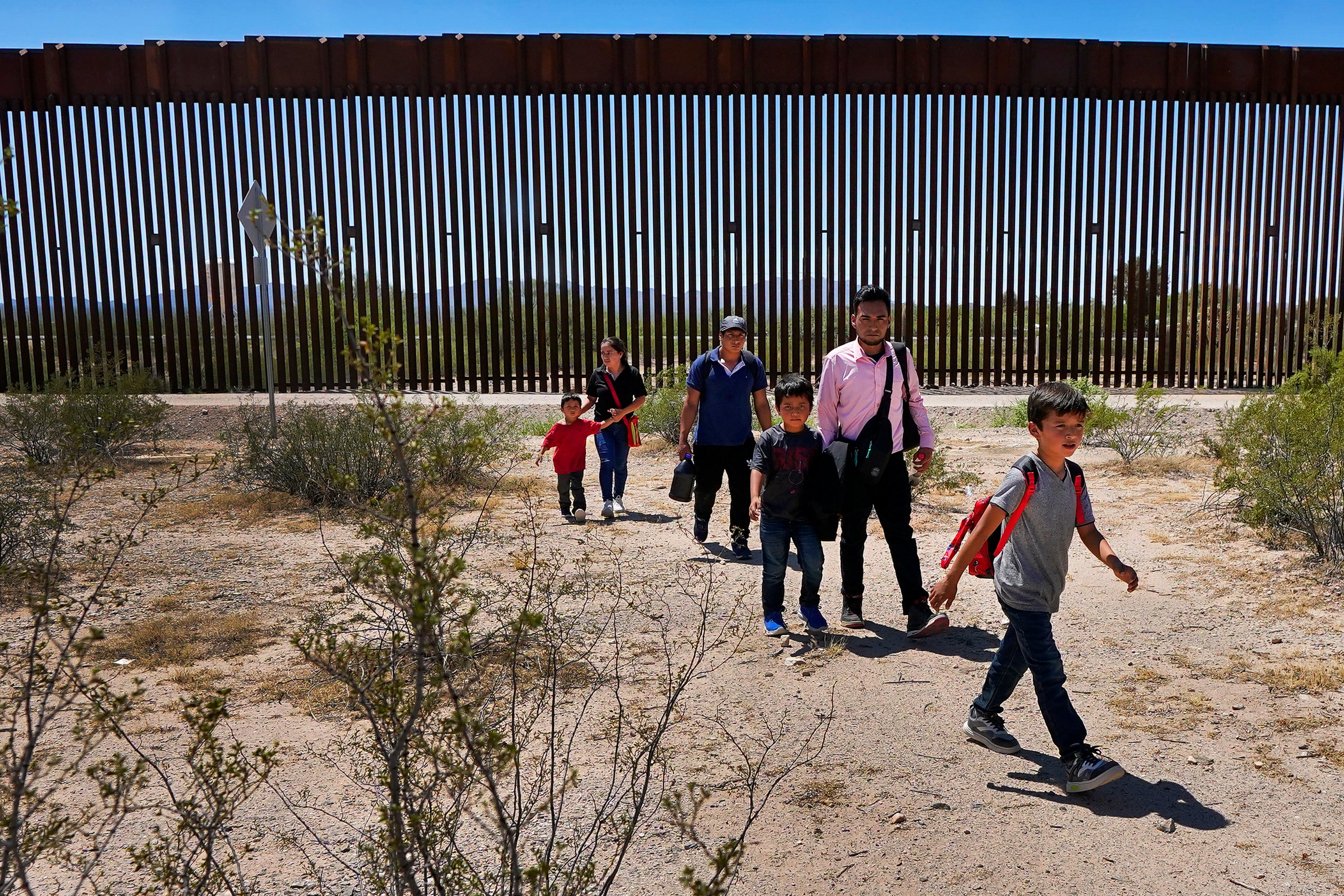 Extensive wall construction throughout multiple administrations has pushed migrants, pictured here in 2023, to attempt to cross in more remote areas across the deserts of the Southwest, putting them at risk of death or injury