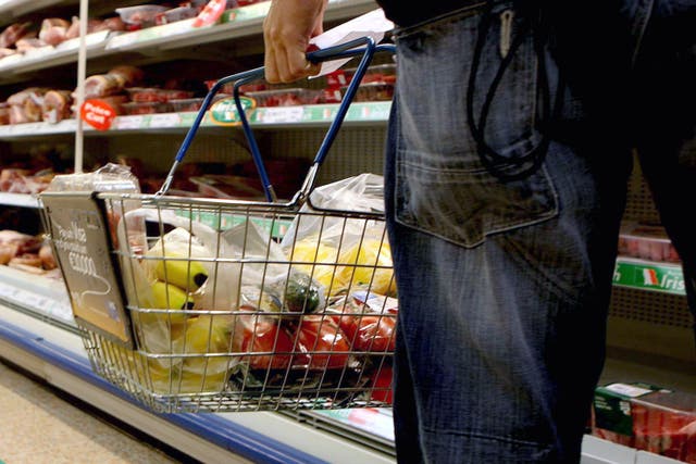 A shopping basket in a supermarket (Julien Behal/PA)