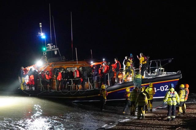 People thought to be migrants are brought in to Dungeness by RNLI lifeboat (Gareth Fuller/PA)