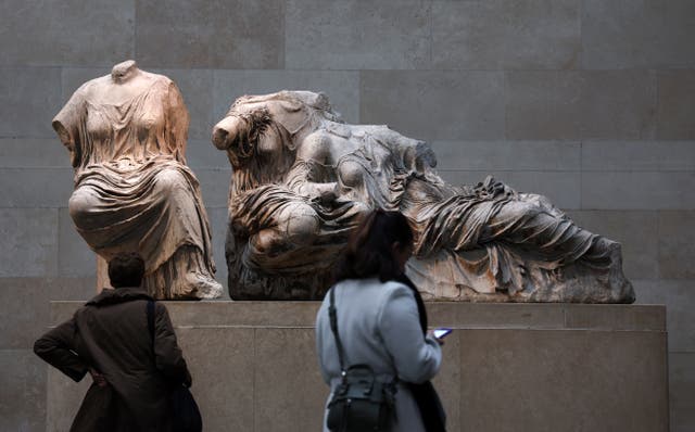 <p>Visitors look at the Parthenon marbles at the British Museum </p>