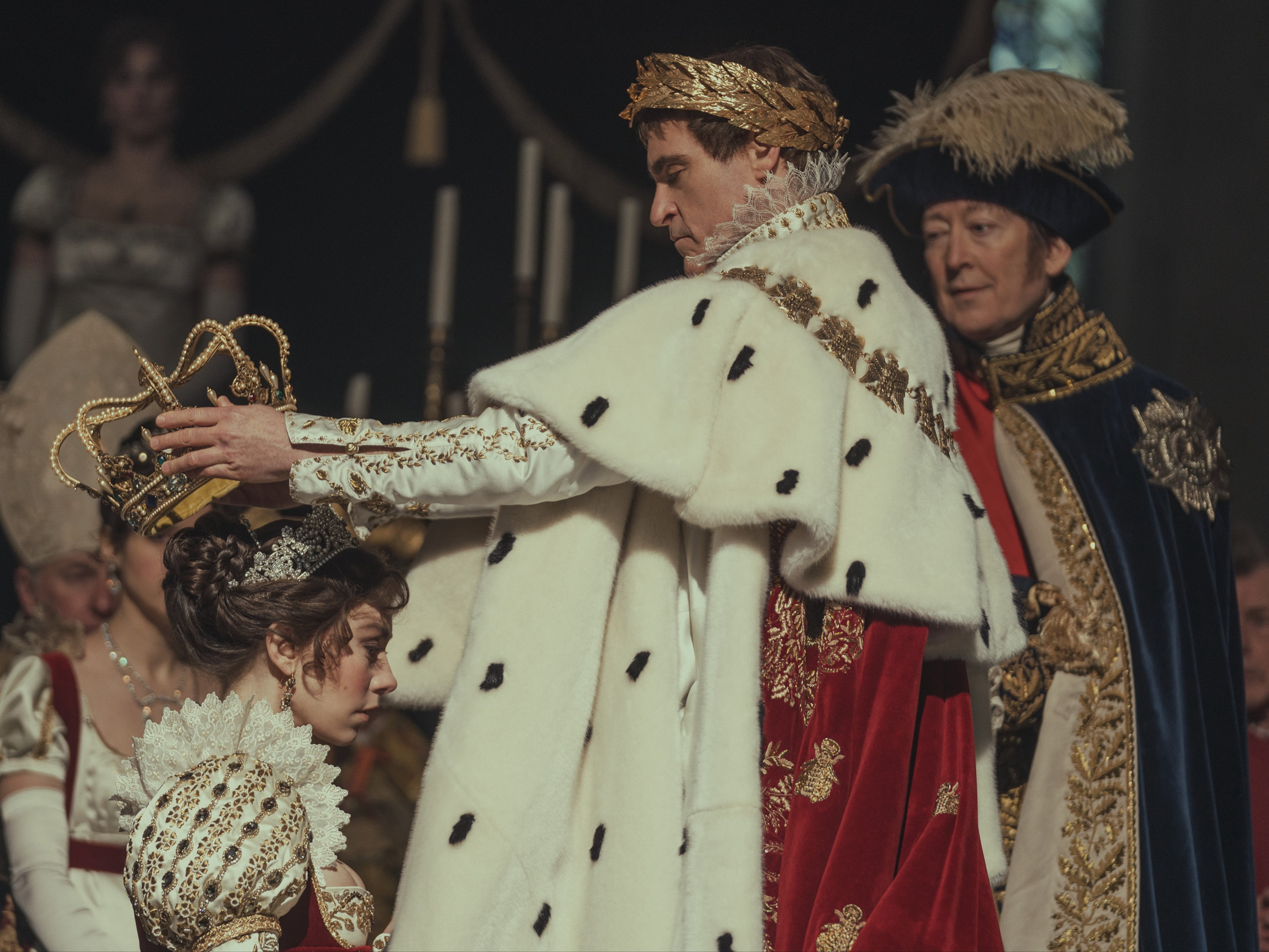 Joaquin Phoenix as Napoléon Bonaparte and Vanessa Kirby as Joséphine de Beauharnais in Ridley Scott’s ‘Napoleon’. In this scene, Bonaparte has just been crowned emperor and his wife is being crowned empress