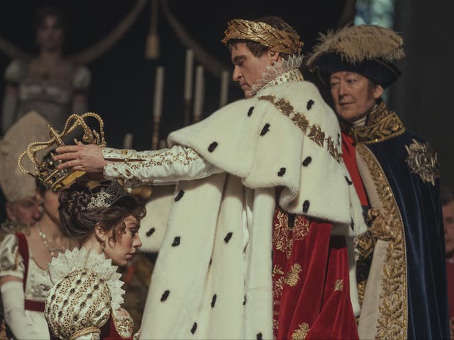 <p>Joaquin Phoenix as Napoléon Bonaparte and Vanessa Kirby as Joséphine de Beauharnais in Ridley Scott’s ‘Napoleon’. In this scene, Bonaparte has just been crowned emperor and his wife is being crowned empress</p>