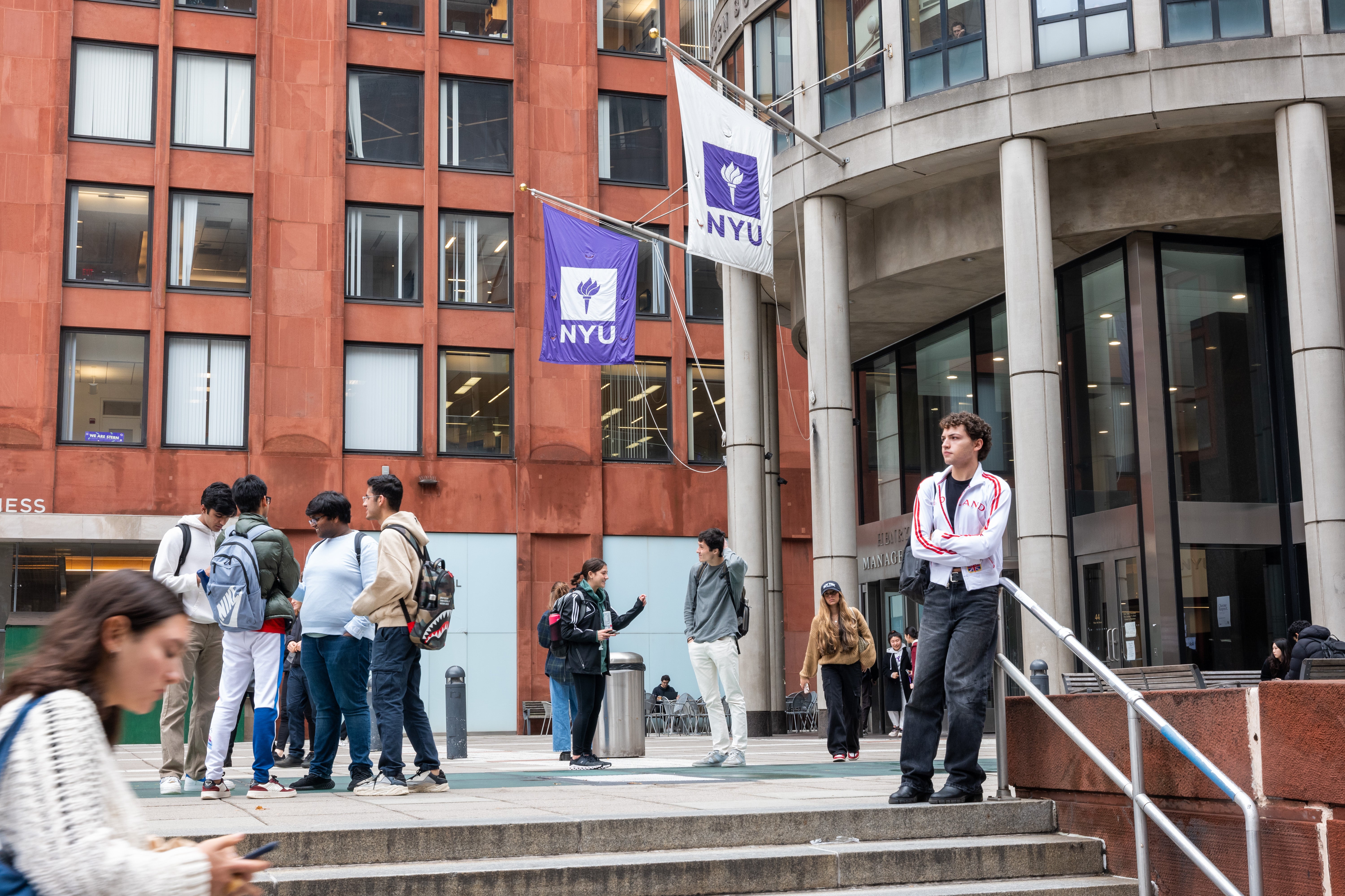 People walk by New York University (NYU) as tensions between supporters of Palestine and Israel increase on college campuses across the nation on October 30, 2023 in New York City.